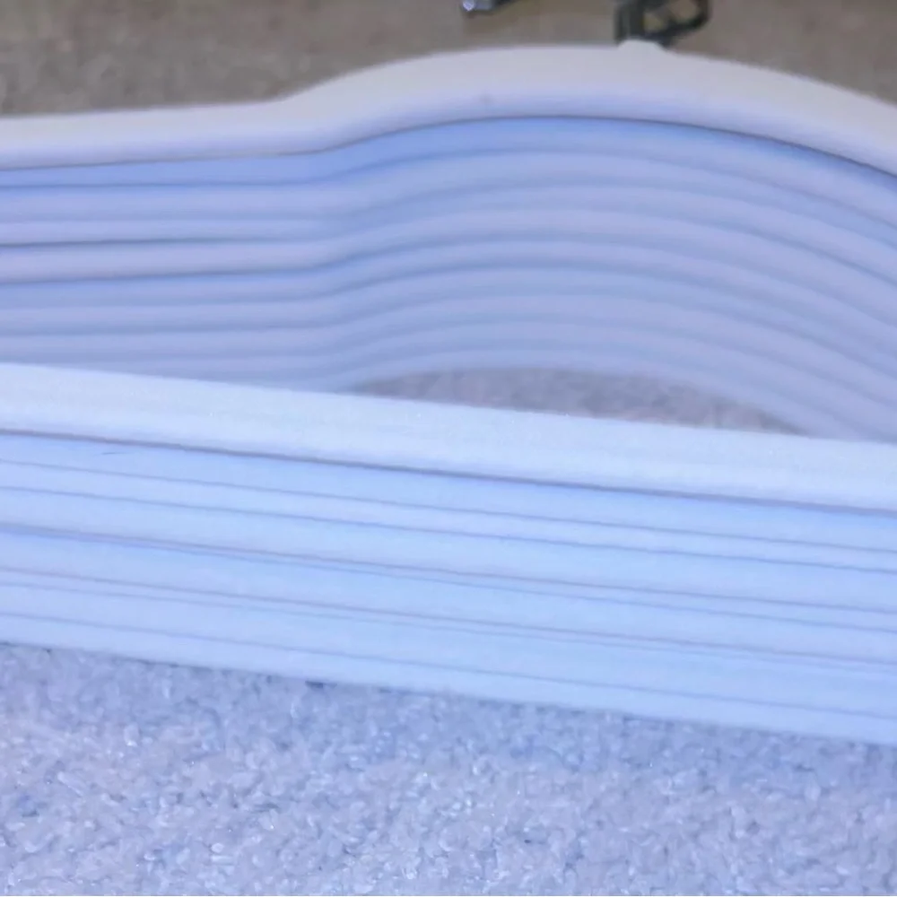 9 pack of white fabric coat hangers